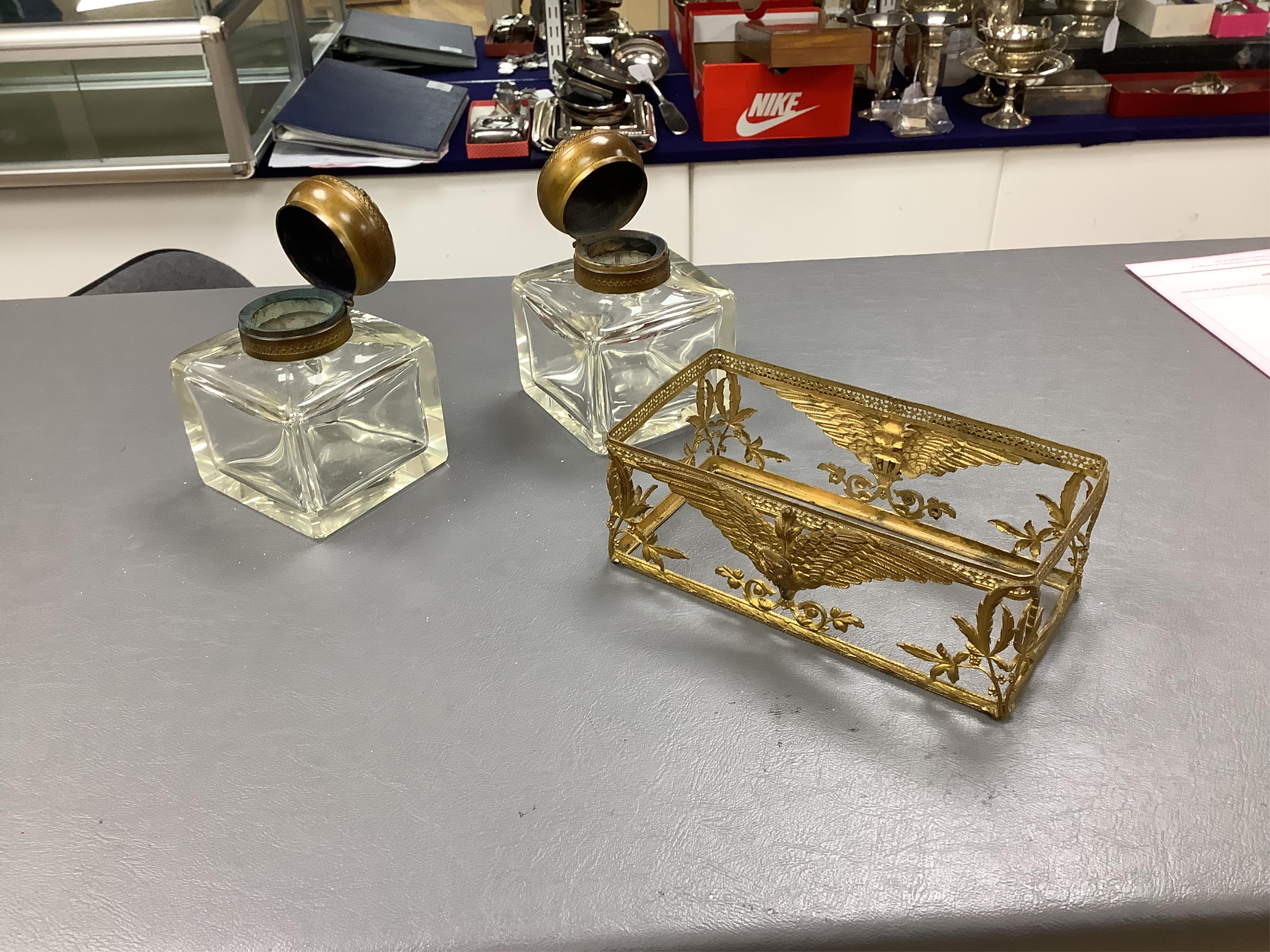 A late 19th/early 20th century French Empire style gilt brass double inkwell, 15cm wide